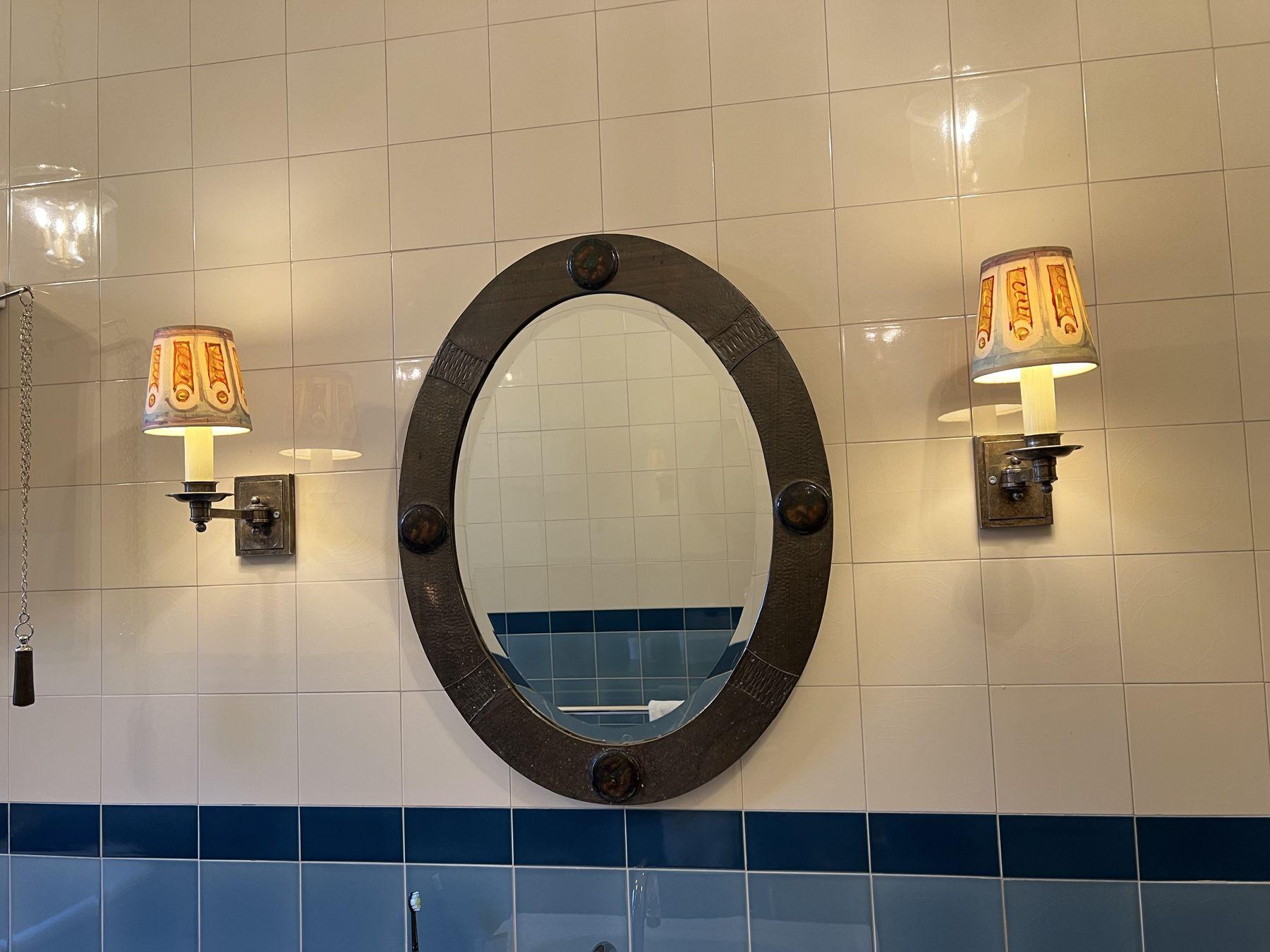 Wall lights either side of a mirror