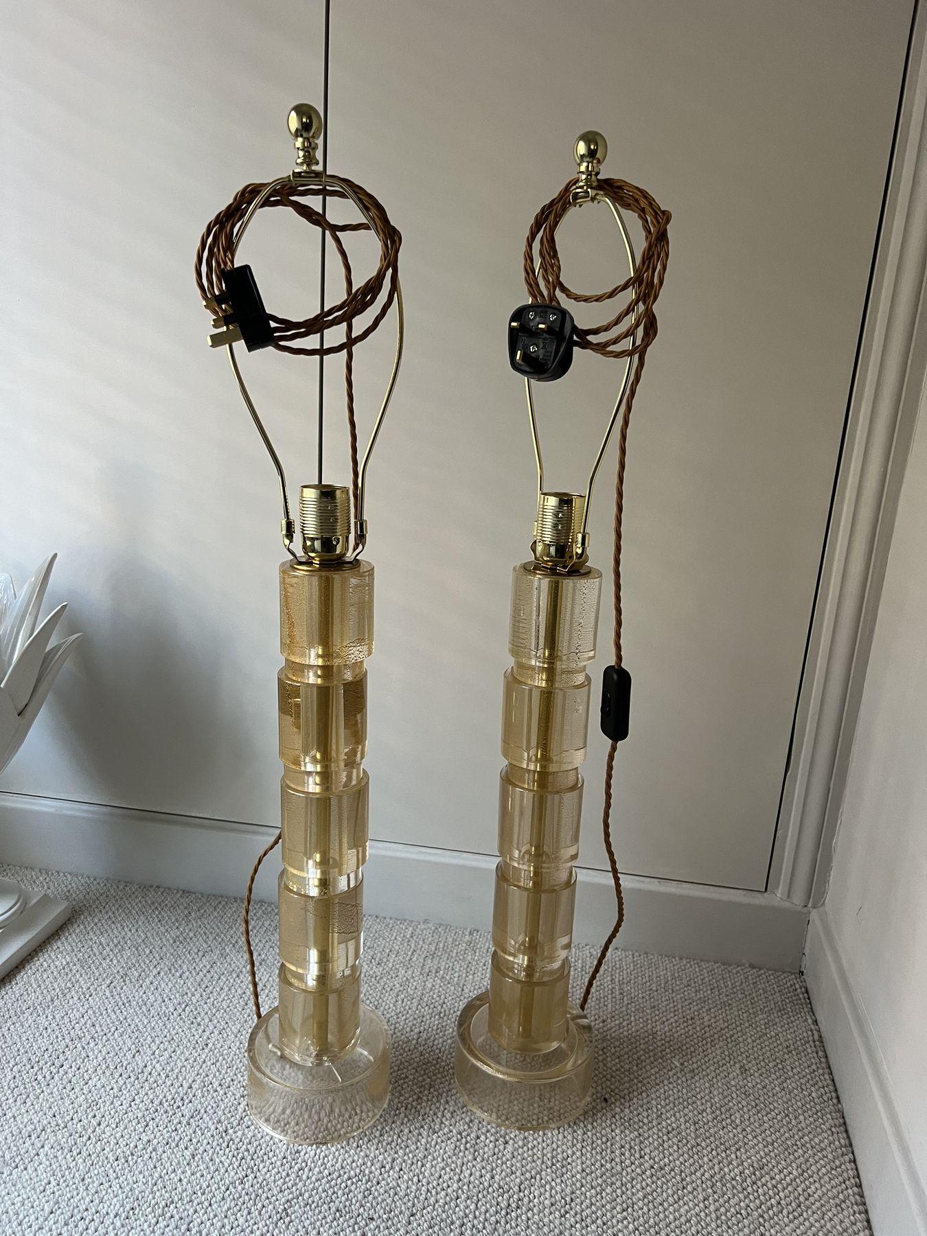 Pair of glass lamps being rewired in the workshop